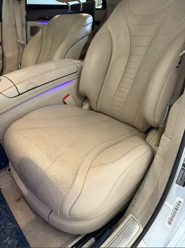 Beige driver seat after leather repair and color restoration